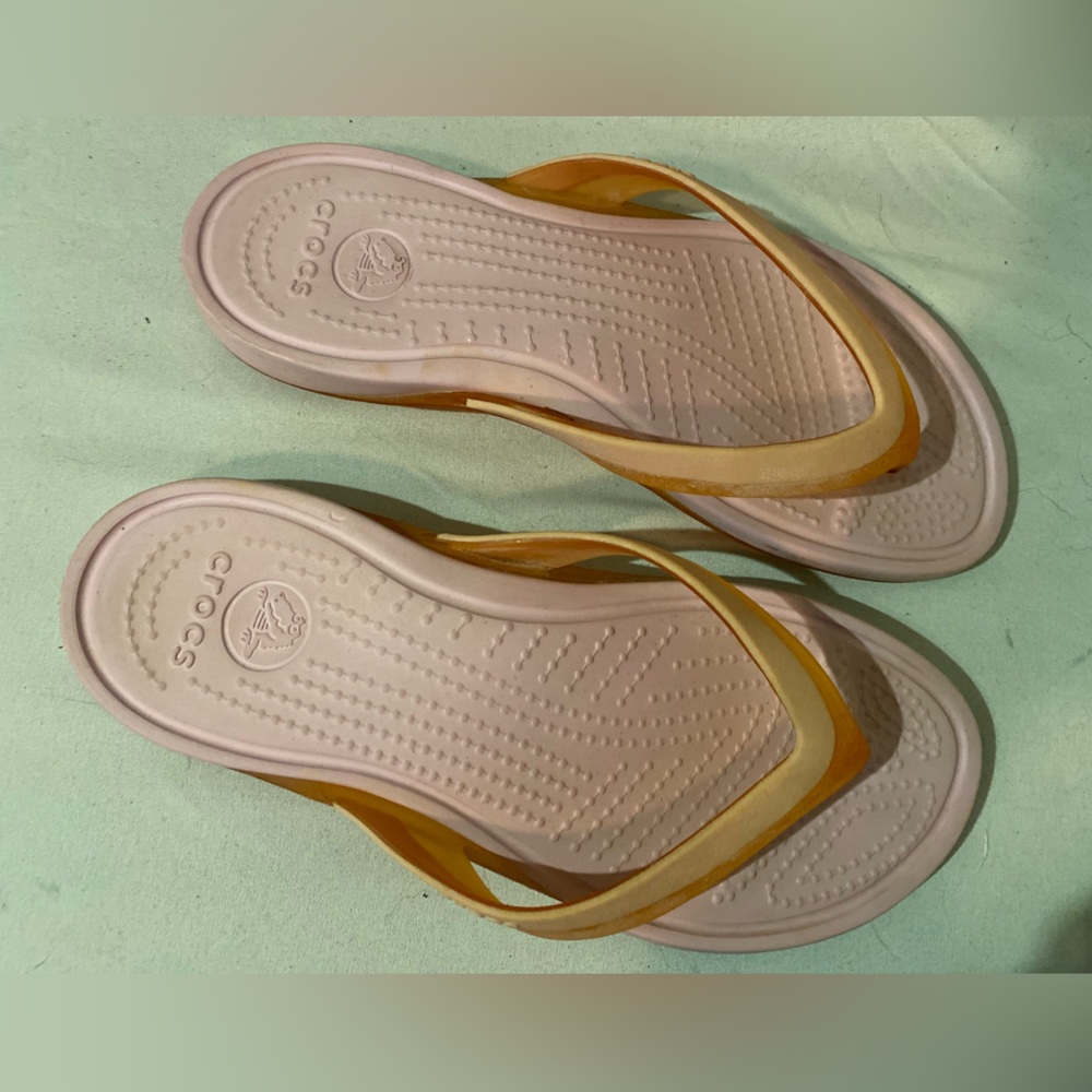 Pretty pink and orange size 7 CROCS flip flops.